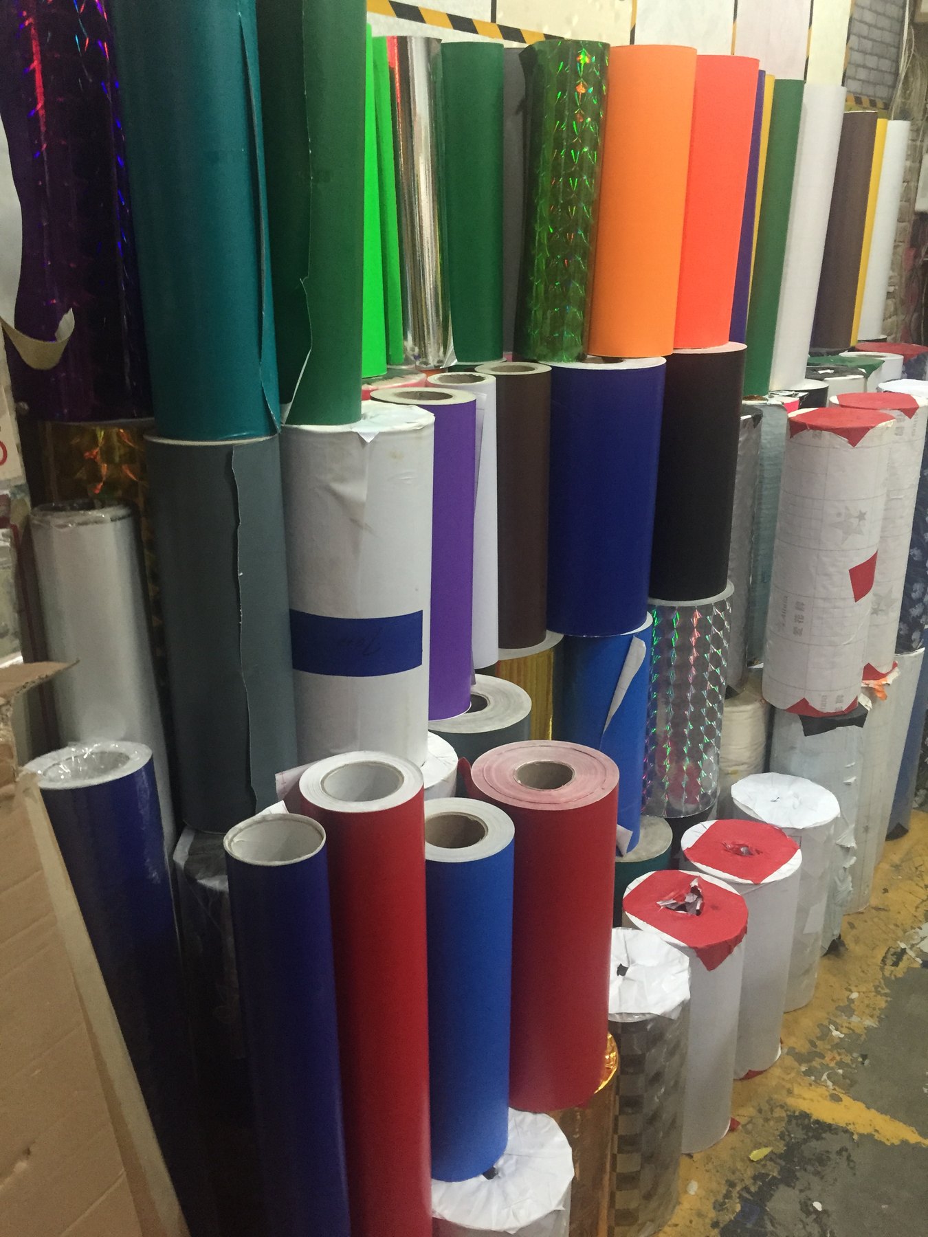 Sandblast resist masking film applied to glass before sandblasting